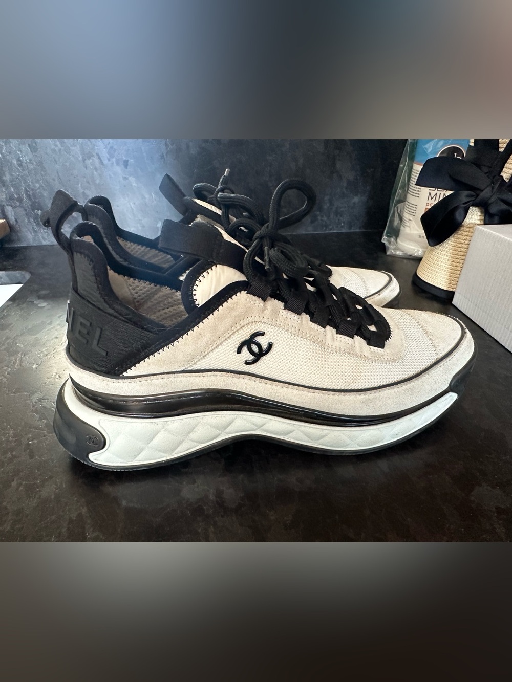 CHANEL White and Black Quilted-Trim Slip-On Sneakers